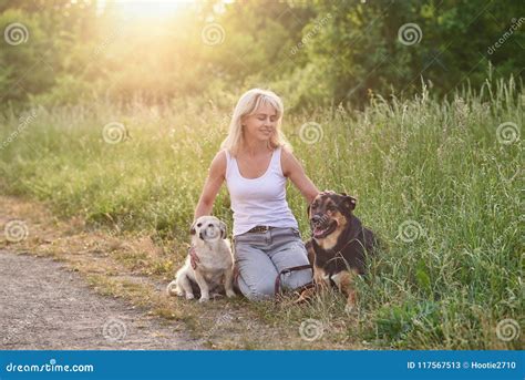 hund und frau sex|Frau mit ihren Hunden im Watt in Cuxhaven Stock Photo